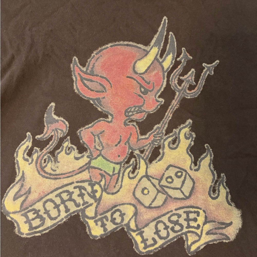 Born to lose over shoulder